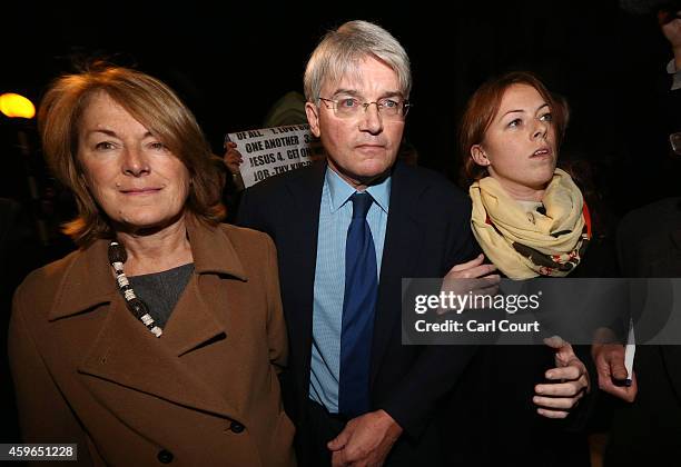 Andrew Mitchell , his wife Dr Sharon Bennett and a woman believed to be his daughter leave the High Court on November 27, 2014 in London, England. A...