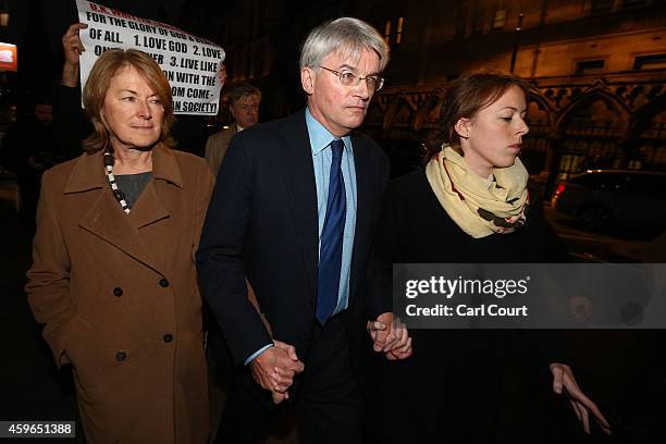 Andrew Mitchell , his wife Dr Sharon Bennett and a woman believed to be his daughter leave the High Court on November 27, 2014 in London, England. A...