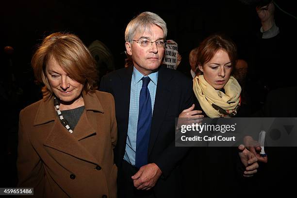 Andrew Mitchell , his wife Dr Sharon Bennett and a woman believed to be his daughter leave the High Court on November 27, 2014 in London, England. A...