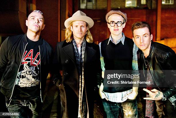 Matt Willis, Dougie Poynter, Tom Fletcher and Danny Jones of McBusted pose backstage at HMV on November 26, 2014 in Leeds, England.