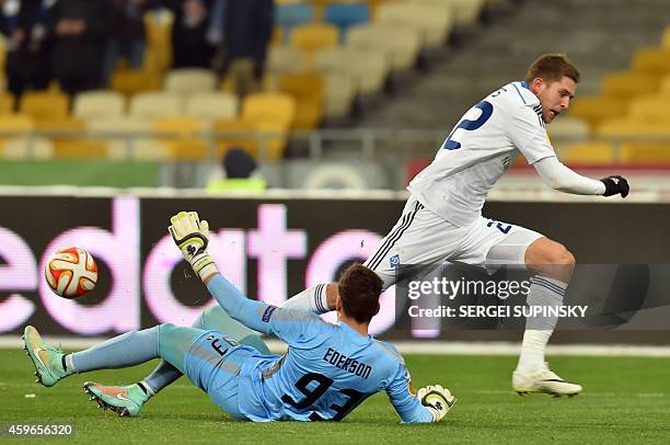 Kiev's Artem Kravets and Ria Ave FC's goalkeeper Ederson fight for the ball, on November 27, 2014 during the UEFA Europa League group J football...