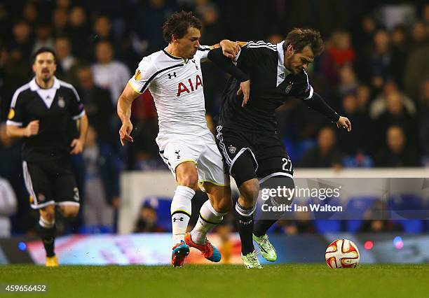 Benjamin Stambouli of Spurs and Danko Lazovic of Partizan Belgrade compete for the ball during the UEFA Europa League group C match between Tottenham...