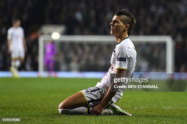 Tottenham Hotspur's Argentinian midfielder Erik Lamela reacts after a missed chance during the UEFA Europa League group C football match between...