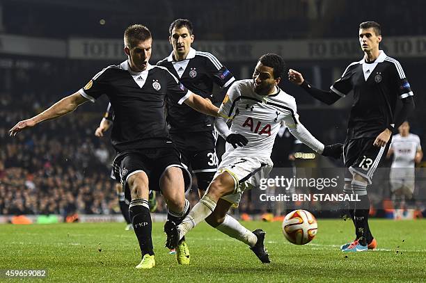 Tottenham Hotspur's English midfielder Aaron Lennon is crowded off the ball during the UEFA Europa League group C football match between Tottenham...