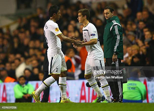 Harry Winks of Spurs replaces Paulinho of Spurs during the UEFA Europa League group C match between Tottenham Hotspur FC and FK Partizan at White...