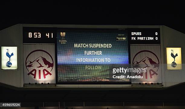 Sign displays a match suspended message after a number of pitch invaders cause the game to be temporarily suspended during the UEFA Europa League...