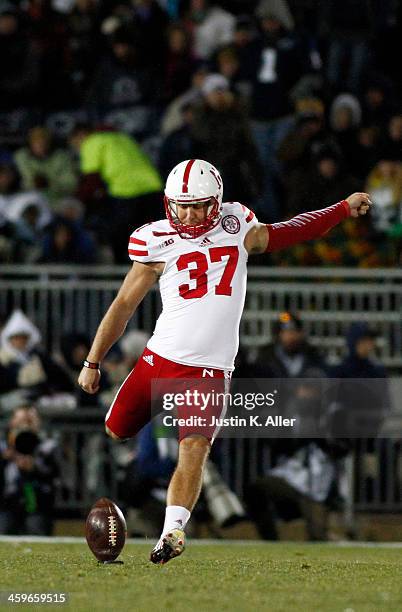 Mauro Bondi of the Nebraska Cornhuskers kicks off against the Penn State Nittany Lions during the game on November 23, 2013 at Beaver Stadium in...