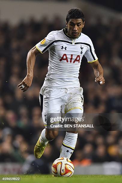 Tottenham Hotspur's Brazilian midfielder Paulinho runs with the ball during the UEFA Europa League group C football match between Tottenham Hotspur...