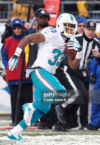 Daniel Thomas of the Miami Dolphins plays against the Pittsburgh Steelers during the game on December 8, 2013 at Heinz Field in Pittsburgh,...