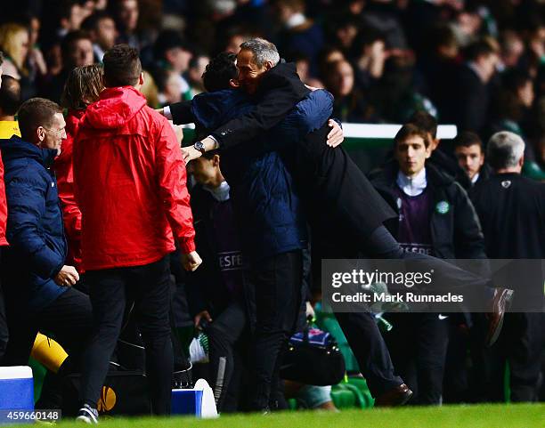 Salzburg manger Adolf Hutter celebrates winning the group with the coaching staff during the UEFA Europa League group D match between Celtic FC and...