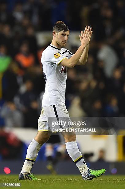 Tottenham Hotspur's Welsh defender Ben Davies claps as he leaves the pitch at the end of the UEFA Europa League group C football match between...