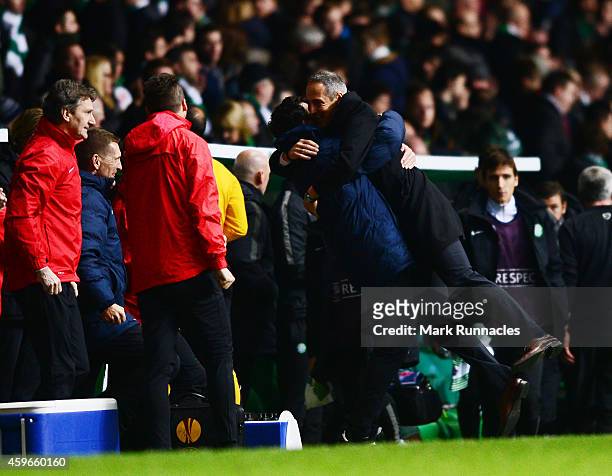Salzburg manger Adolf Hutter celebrates winning the group with the coaching staff during the UEFA Europa League group D match between Celtic FC and...