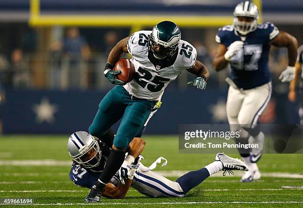 LeSean McCoy of the Philadelphia Eagles runs over C.J. Spillman of the Dallas Cowboys on his way to a touchdown in the second half at AT&T Stadium on...