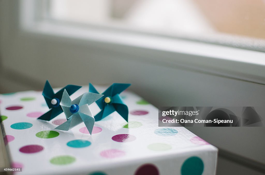 Three blue paper windmills