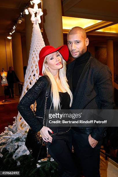 Xavier Delarue and his wife Tatiana-Laurens Delarue are is pictured in front of Jean-Paul Gaultier Christmas tree during the 19th Edition of 'Les...