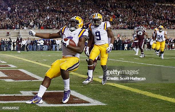 Leonard Fournette of the LSU Tigers runs for a 22-yard touchdown against the Texas A&M Aggies in the first half of their game at Kyle Field on...