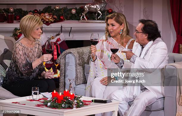 Carmen Nebel , Al Bano Carrisi and Romina Power attend the taping of the TV show 'Heiligabend mit Carmen Nebel' on November 27, 2014 in Munich,...