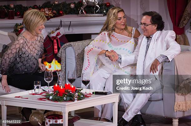 Carmen Nebel , Al Bano Carrisi and Romina Power attend the taping of the TV show 'Heiligabend mit Carmen Nebel' on November 27, 2014 in Munich,...
