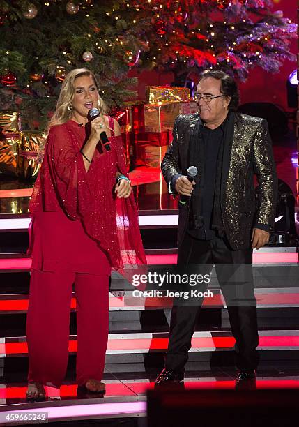 Italian pop duo Al Bano and Romina Power perform at the taping of the TV show 'Heiligabend mit Carmen Nebel' on November 27, 2014 in Munich, Germany.