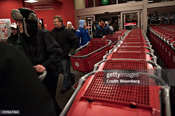 Customers enter a Target Corp. Store ahead of Black Friday in Mentor, Ohio, U.S., on Thursday, Nov. 27, 2014. An estimated 140 million U.S. Shoppers...