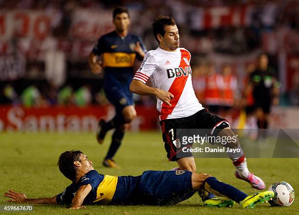 Juan Forlin of Boca Juniors and Rodrigo Mora of River Plate fight for the ball during a second leg semifinal match between River Plate and Boca...