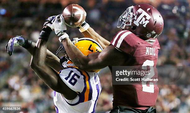 Speedy Noil of the Texas A&M Aggies hauls in a touchdown pass in front of Tre'Davious White of the LSU Tigers during the second half of their game at...