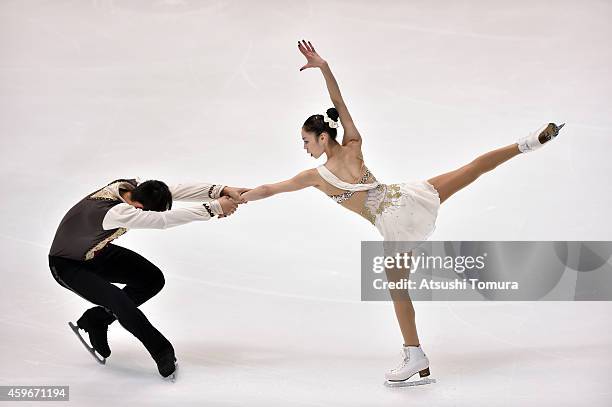 Xiaoyu Yu and Yang Jin of China compete in the Pairs Short Program during day one of ISU Grand Prix of Figure Skating 2014/2015 NHK Trophy at the...