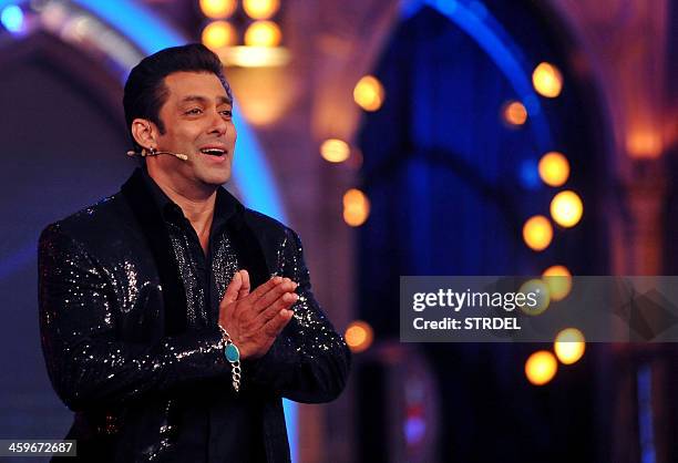 Indian Bollywood actor Salman Khan gestures while hosting the final of the reality show 'Bigg Boss 7 in Mumbai on late December 28, 2013. AFP...
