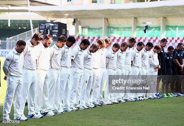 Players of New Zealand line up before the start of play to observe a minute's silence in memory of Australian cricketer Phillip Hughes who died as a...