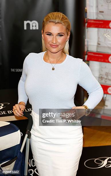 Billie Faiers attends a photocall to launch The Signature Range at Mothercare Oxford Street on November 28, 2014 in London, England.