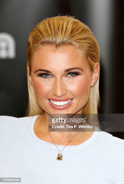Billie Faiers attends a photocall to launch The Signature Range at Mothercare Oxford Street on November 28, 2014 in London, England.