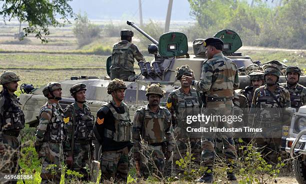 An Indian Army officer briefing his team during an encounter with militants at Pindi Khattar village of the Arnia border sector on November 28, 2014...