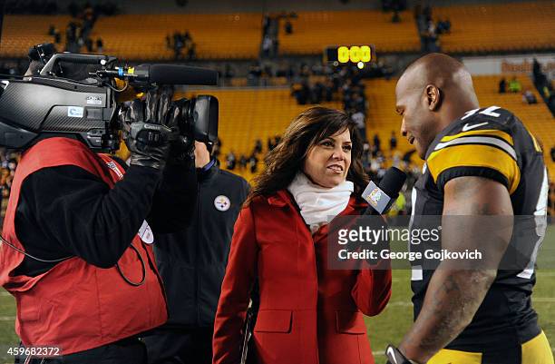 Sports NFL Sunday Night Football sideline reporter Michele Tafoya interviews linebacker James Harrison of the Pittsburgh Steelers after a game...
