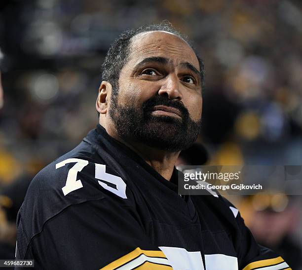 Franco Harris, former running back for the Pittsburgh Steelers and member of the Pro Football Hall of Fame, looks on from the sideline before a game...