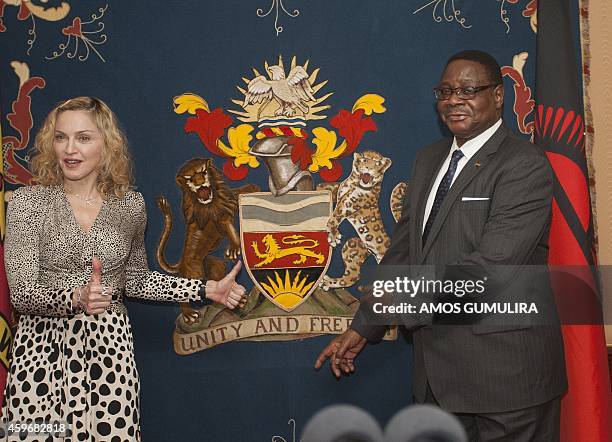 Pop Star Madonna poses with Malawi's president Professor Peter Mutharika prior to their meeting at Kamuzu Palace in the Capital Lilongwe, on November...