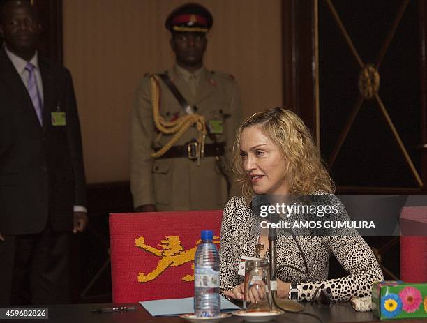 Pop Star Madonna makes a statement following her meeting with Malawi's president Professor Peter Mutharika, at Kamuzu Palace in the Capital Lilongwe,...