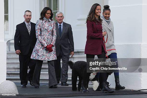 First lady Michelle Obama , her daughters Sasha Obama and Malia Obama and their family dogs, Bo and Sonny; and tree growers Chris Botek and Francis...