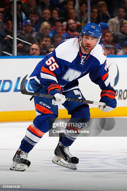Johnny Boychuk of the New York Islanders skates against the Washington Capitals at Nassau Veterans Memorial Coliseum on November 26, 2014 in...