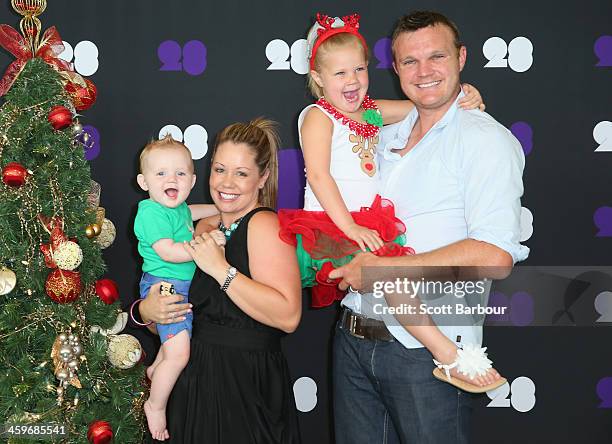 Doug Bollinger of Australia poses with his wife Tegan Bollinger and their children ahead of the Cricket Australia Christmas Day Lunch at Crown...