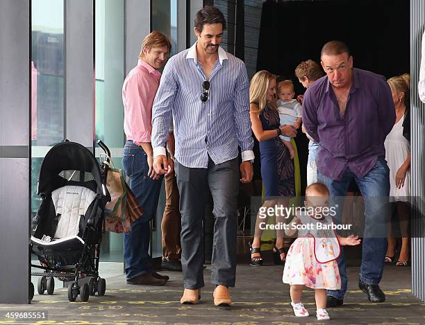 Mitchell Johnson of Australia plays with his daughter Rubika ahead of the Cricket Australia Christmas Day Lunch at Crown Metropol on December 25,...