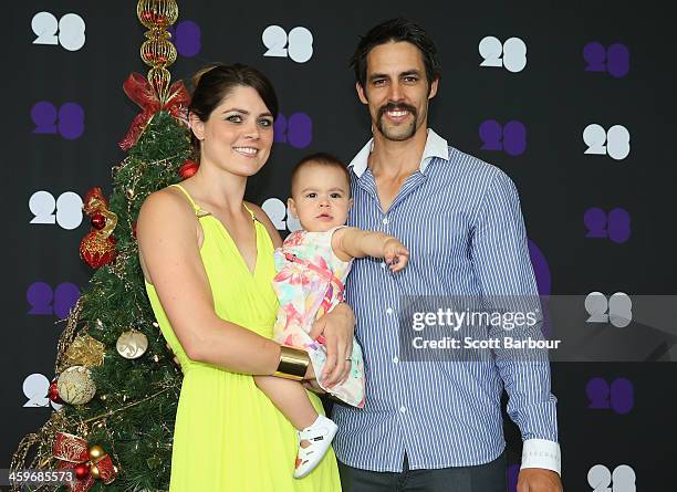 Mitchell Johnson of Australia poses with his wife Jessica Bratich-Johnson and daughter Rubika ahead of the Cricket Australia Christmas Day Lunch at...