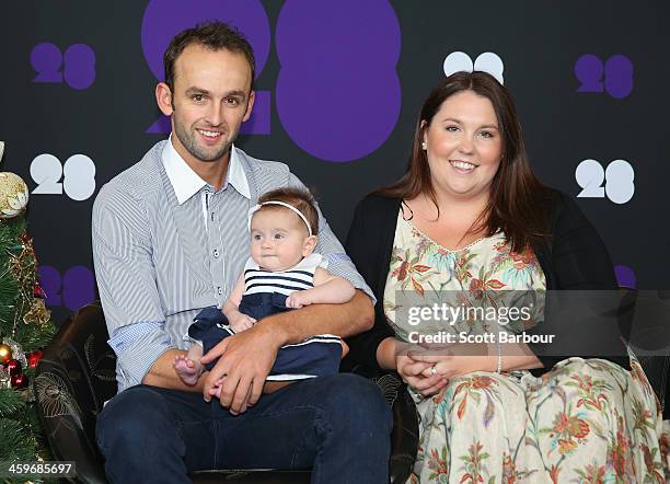 Nathan Lyon of Australia poses with his partner Melissa Waring and daughter Harper ahead of the Cricket Australia Christmas Day Lunch at Crown...