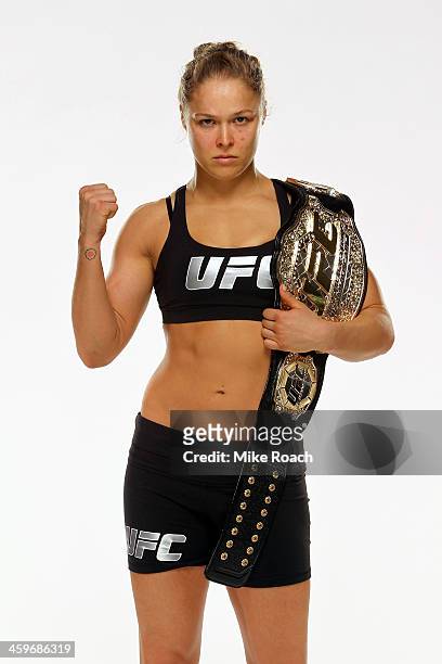 Women's Bantamweight Champion Ronda Rousey poses for a post-fight portrait after defeating Miesha Tate by taopout during the UFC 168 event at the MGM...