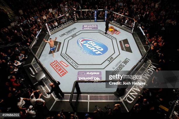 Chris Weidman reacts after his TKO victory over Anderson Silva in their UFC middleweight championship bout during the UFC 168 event at the MGM Grand...