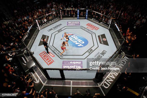 Ronda Rousey kicks Miesha Tate in their UFC women's bantamweight championship bout during the UFC 168 event at the MGM Grand Garden Arena on December...