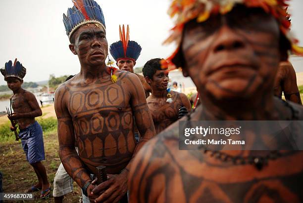 Members of the Munduruku indigenous tribe gather along the Tapajos River during a "Caravan of Resistance'" protest by indigenous groups and...