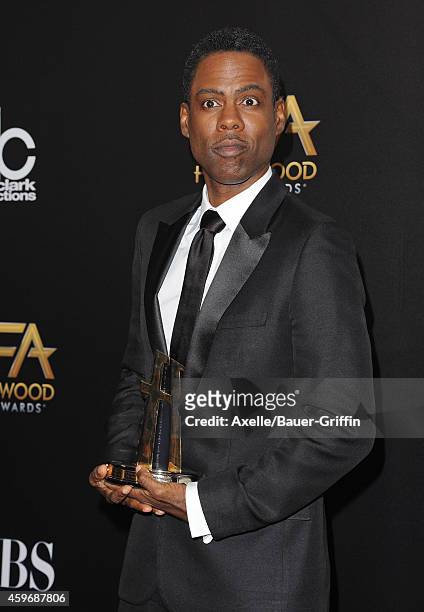 Actor Chris Rock poses in the press room during the 18th Annual Hollywood Film Awards at The Palladium on November 14, 2014 in Hollywood, California.