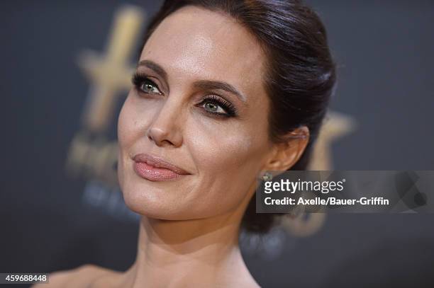Actress/director Angelina Jolie poses in the press room during the 18th Annual Hollywood Film Awards at The Palladium on November 14, 2014 in...