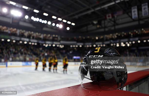 The helmet belonging to Brett Gustavsen of the Belleville Bulls rests on the boards during an OHL game between the Belleville Bulls and the Niagara...