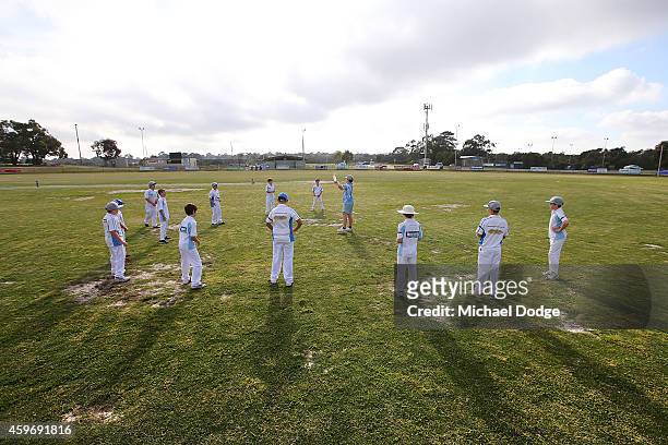 Langwarrin cricketers warm up with fielding practice at Lloyd Park before an U/12 match between Langwarrin and Somerville at Lloyd Park on November...